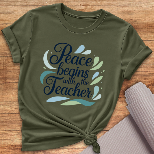 Begins With The Teacher T-Shirt